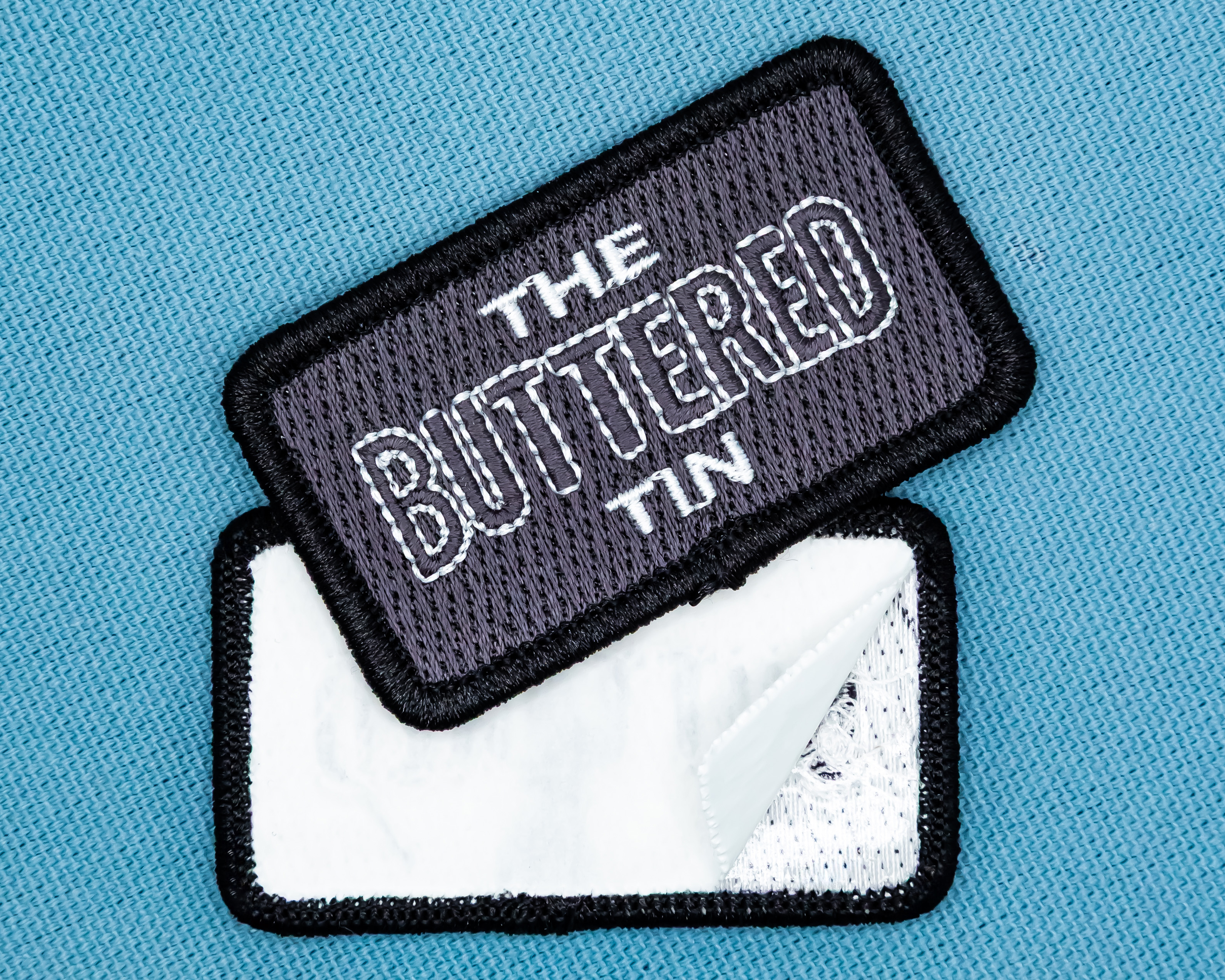 Iron-on patches showing iron-on backing types for custom embroidered patches