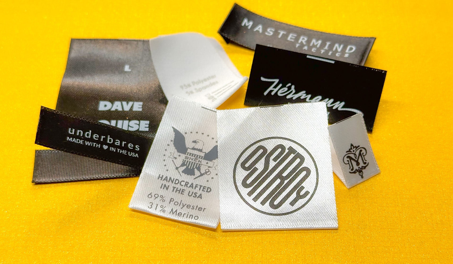 Printed satin clothing labels showing different fold styles